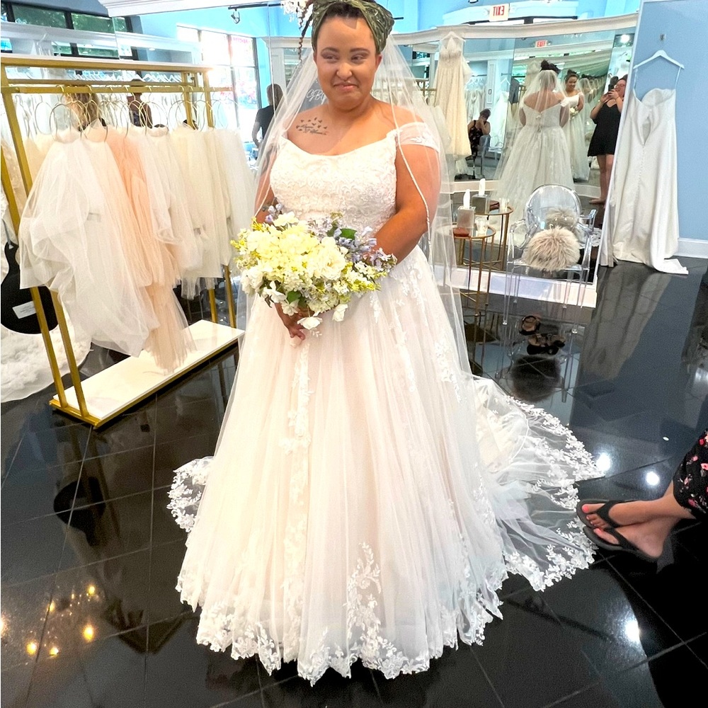 Wedding dress never worn. Only tried on the day in the pictures.
